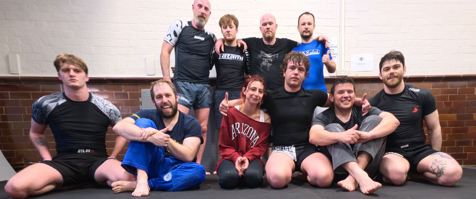 Members of Ace Jiu Jitsu on the mats after a class